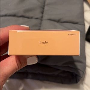 Laura Geller new in box baked coloring correcting foundation. Shade light.